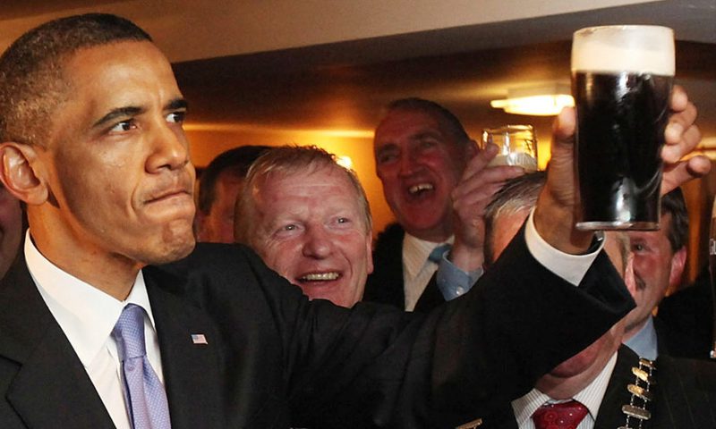 Barack holding a pint of guinness